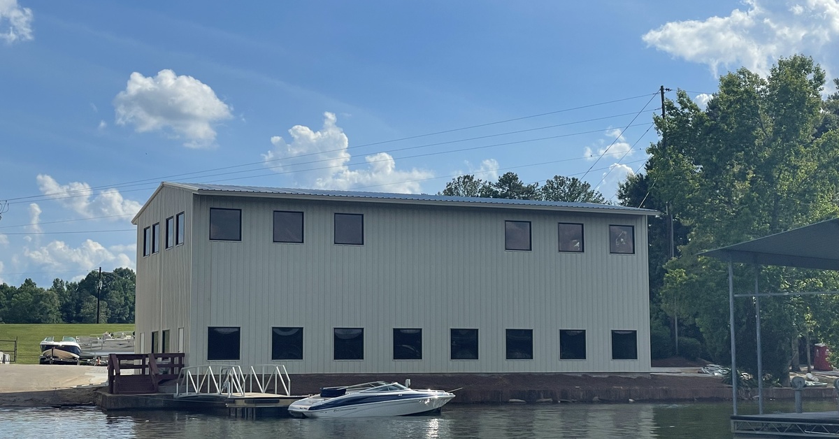 Custom-engineered steel building designed for waterfront and marine applications, providing expansive storage, workshop, and recreational space with durable, low-maintenance construction.