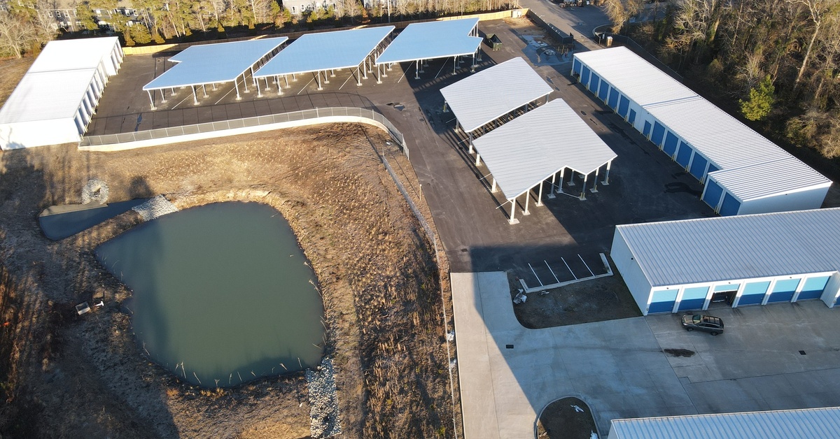 Large-scale storage facility combining enclosed units and covered vehicle parking structures, delivering flexible protection for RVs, boats, automobiles, and commercial equipment.